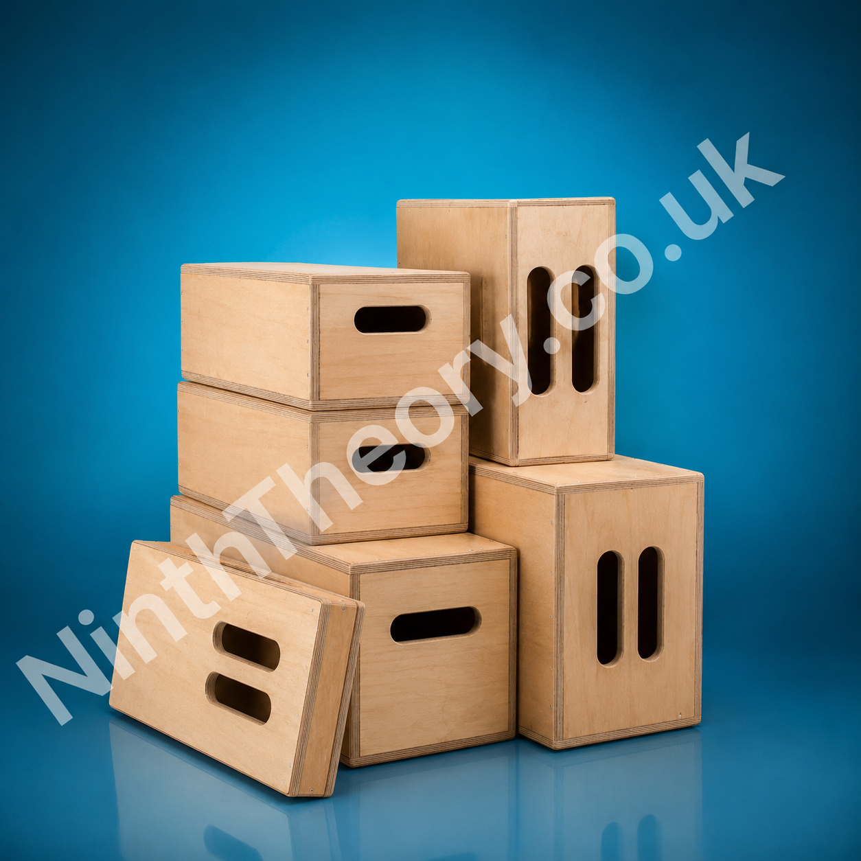 Production wooden apple boxes on a teal studio background